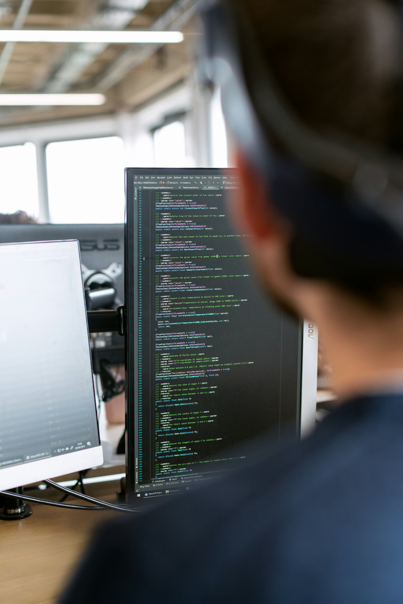 A developer building integrations across multiple screens of code