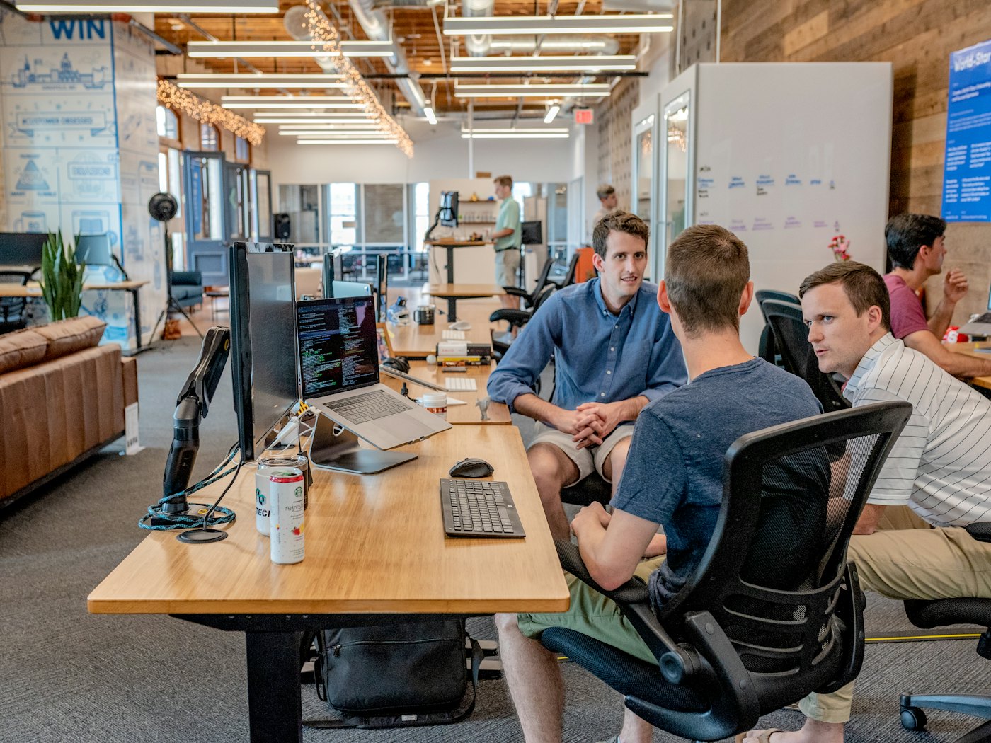 A relaxed first conversation between teams in an office
