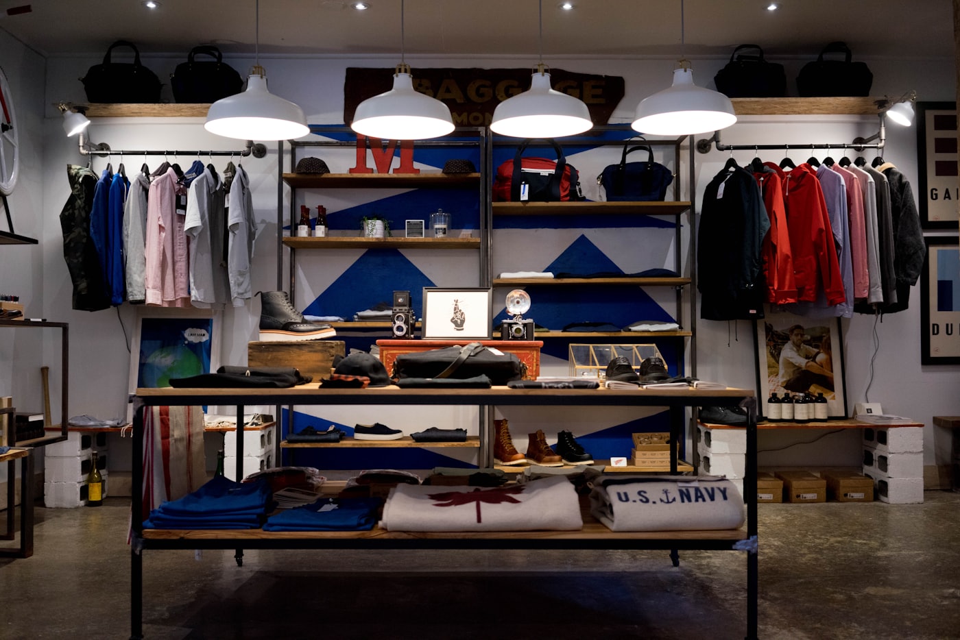 A well-lit retail store with stocked shelves and racks
